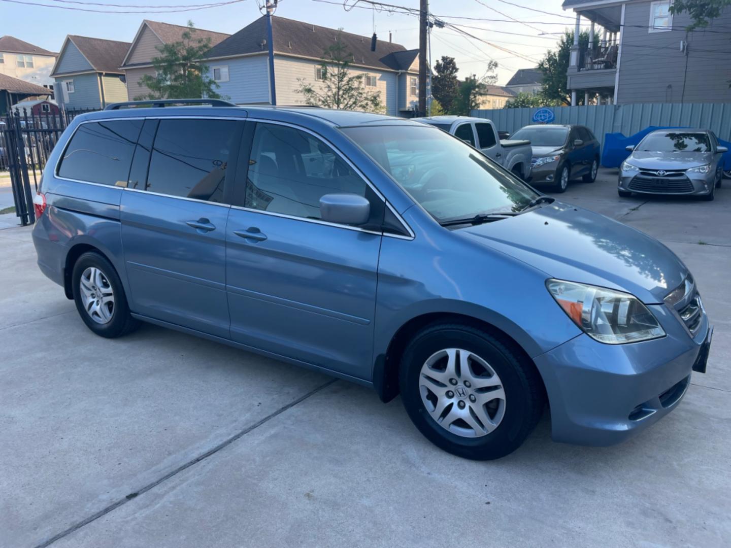 2007 Blue /Silver Honda Odyssey EX (5FNRL38457B) with an 3.5L V6 SOHC 24V engine, 5-Speed Automatic Overdrive transmission, located at 1501 West 15th St., Houston, 77008, (713) 869-2925, 29.797941, -95.411789 - Photo#1